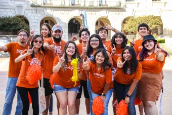 group of students in front of the tower