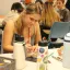 Student writing and decorating a pouch